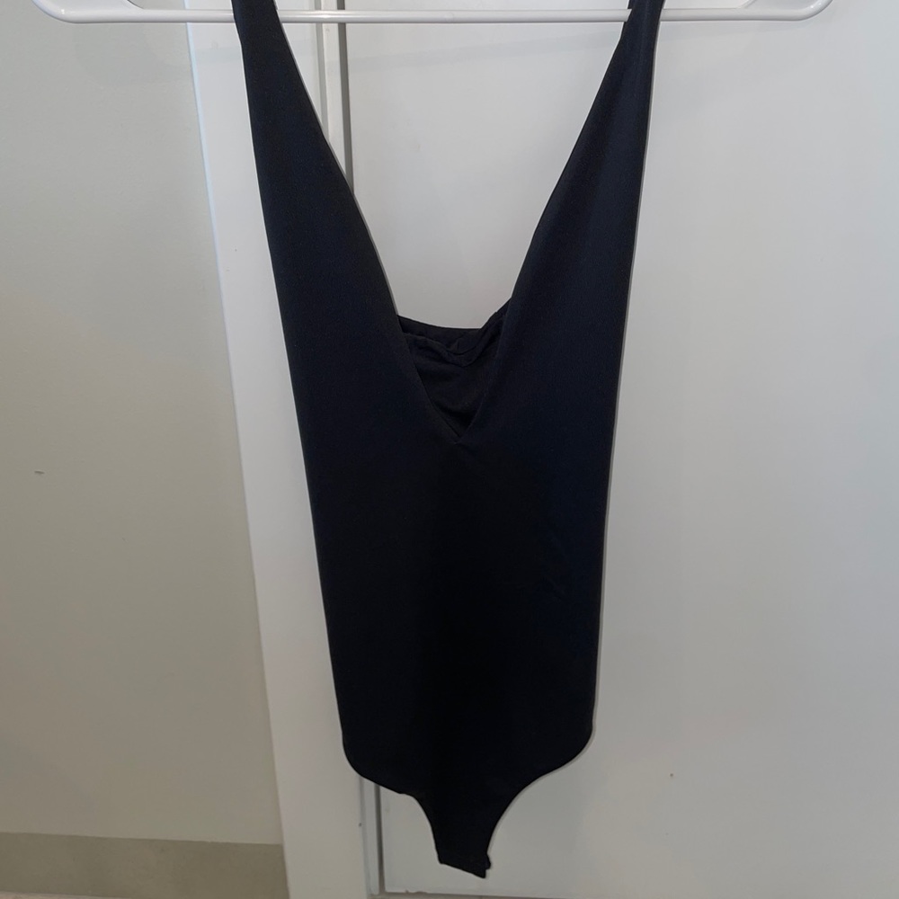 Back crossed crossed body suit